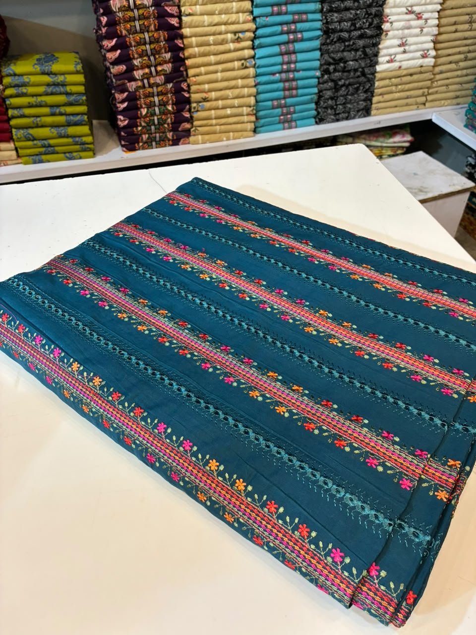 Mughalia Premium Unstitched 2-piece fabric set with intricate traditional Mughal-inspired patterns in vibrant colors.