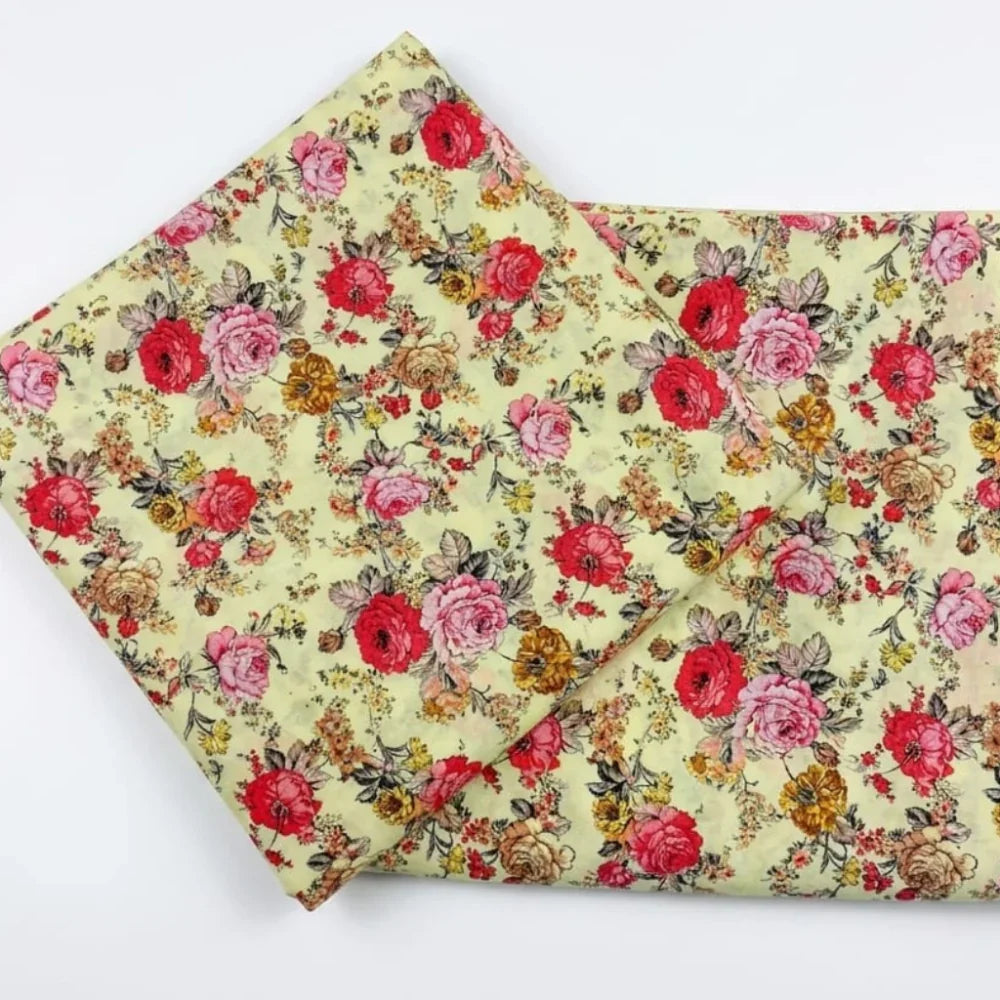 Vintage floral fabric with red pink roses on pale yellow background, ideal for sewing and crafts