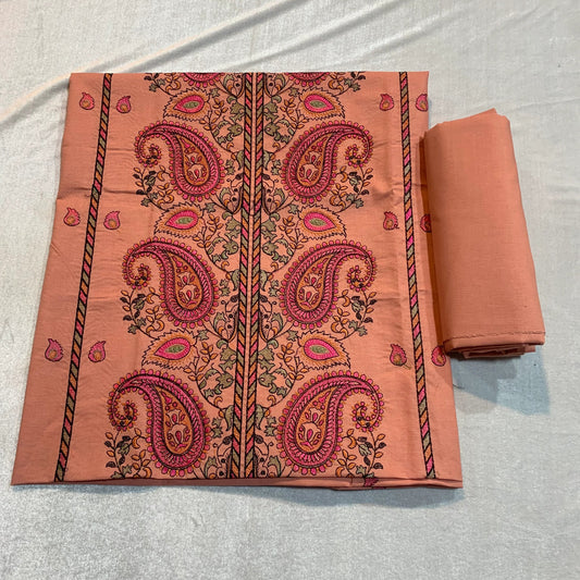 Peach lawn fabric with pink paisley print, perfect for unstitched suits and designer wear.