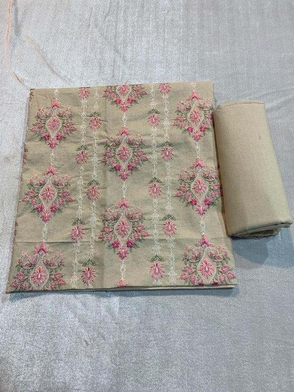 Beige lawn fabric with pink floral embroidery, ideal for designer unstitched suits