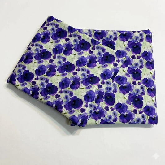 Purple floral print fabric with watercolor poppies on light green background, ideal for sewing and crafts