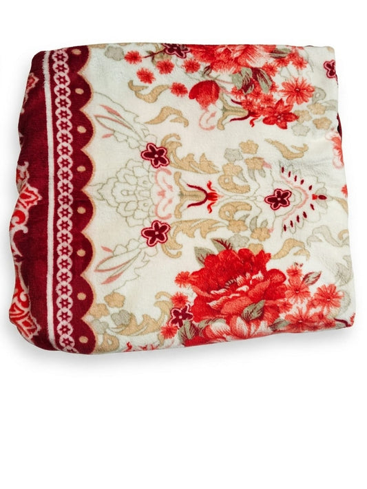 Soft, plush Mughalia Premium AC Blanket draped over a sofa, showcasing its cozy, high-quality fabric and elegant design.