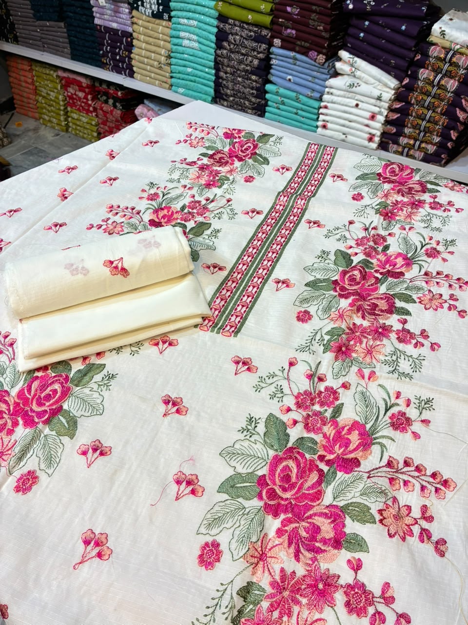 Mughalia Premium Unstitched 2-piece fabric set with intricate Mughal-inspired patterns, displayed flat on a white background.