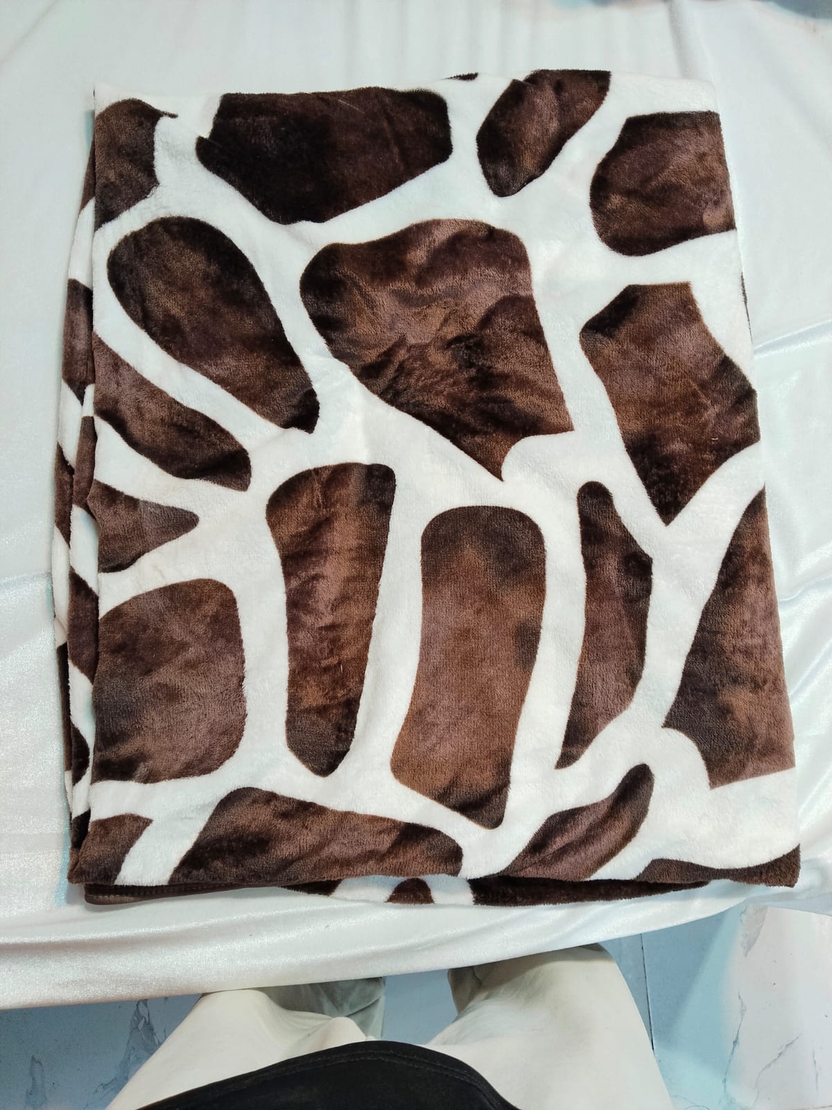 Mughalia premium AC blanket in soft, cozy fabric, shown folded with intricate patterns and warm, luxurious texture.