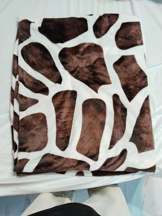 Mughalia premium AC blanket in soft, cozy fabric, shown folded with intricate patterns and warm, luxurious texture.